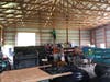 Volunteers install electrical wiring at The Barn at Snipes Farm.