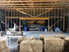 Volunteers work to transform the barn from storage space to concert venue.