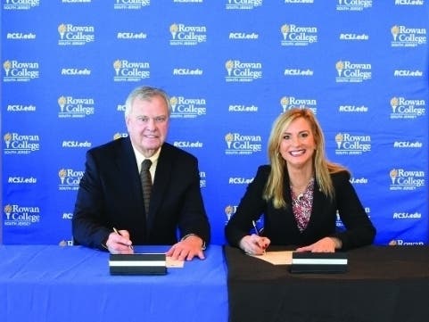 RCSJ President Frederick Keating and Princeton University Associate Dean and Director of Professional Development Eva Kubu sign a Community College Teaching Partnership agreement. 