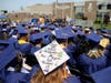 RCSJ graduates look as the 4th annual commencement ceremony begins on the Gloucester Campus. Students decorate their caps celebrating their accomplishments and next steps on their educational journey. 