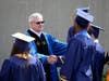 RCSJ President, Dr. Frederick Keating, congratulates students on the Gloucester Campus before the 4th annual commencement ceremonies. 