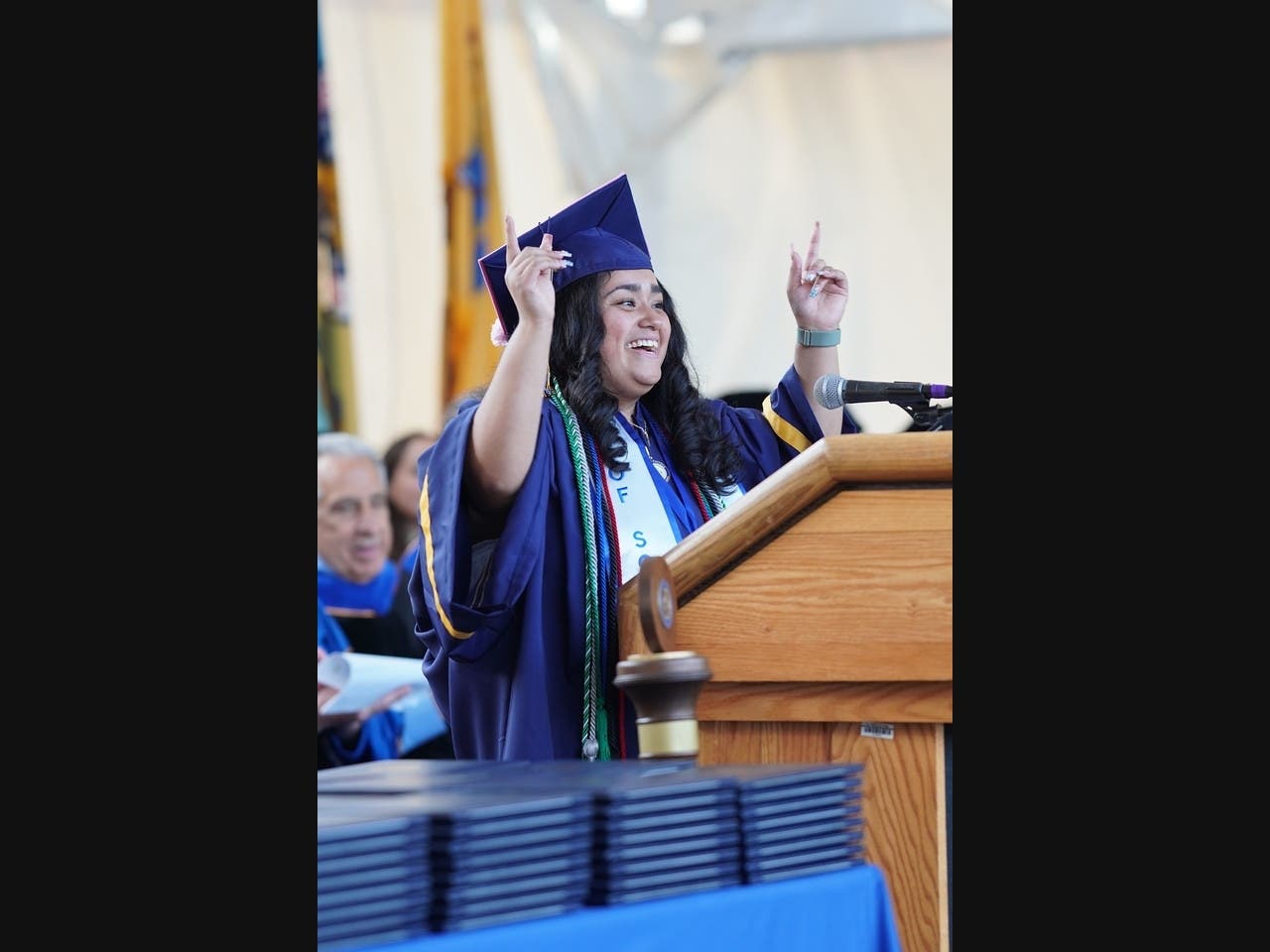 Marisol P., first-generation and RCSJ–Cumberland student commencement speaker, gives props to her fellow graduates for a job well done. 
