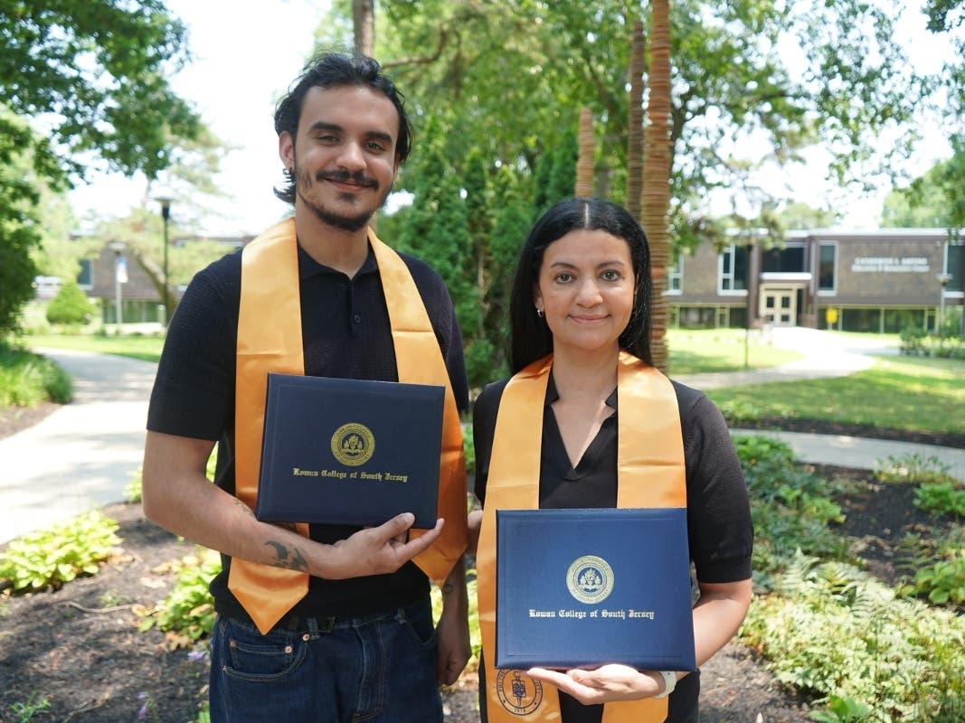 Mother and son, Branden and Brenda Zeitone, proudly display their diploma jackets after graduating together from Rowan College of South Jersey's Cumberland Campus in May.