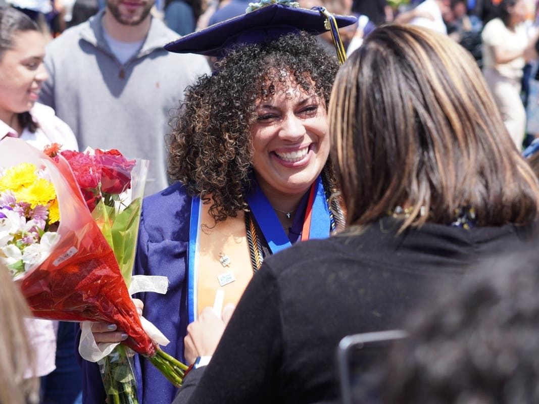 RCSJ alumna and single mom, Blanca Garcia, achieves her long-awaited ambition of earning an associate degree during RCSJ Gloucester's 7th annual commencement ceremony.