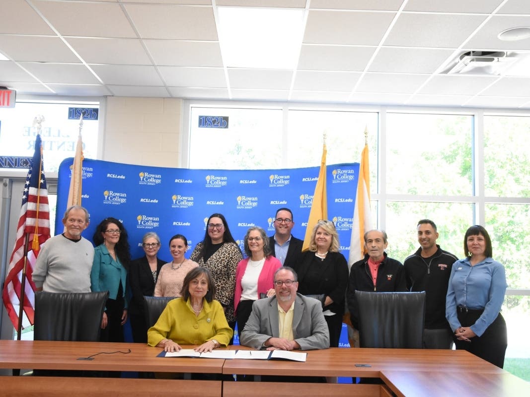 RCSJ faculty, staff, and community members came together to show support at the Kristen Whyte Endowment Signing Ceremony. (Front, left to right): Roseanne Paone-Petrucci, Kristen's mother; Dr. Brenden Rickards, RCSJ president.