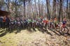 Mountain bike youth getting reading for a race.