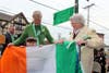 Liam Buckheit, 6, helps Mayor Nancy R. Rossi present an Irish flag to his great-grandmother, Joan D. Connor. 