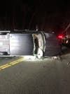 Overturned Pick Up Truck with windshield removed.