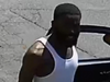 Surveillance image of man accused of hitting a pedestrian with a vehicle and leaving the scene.