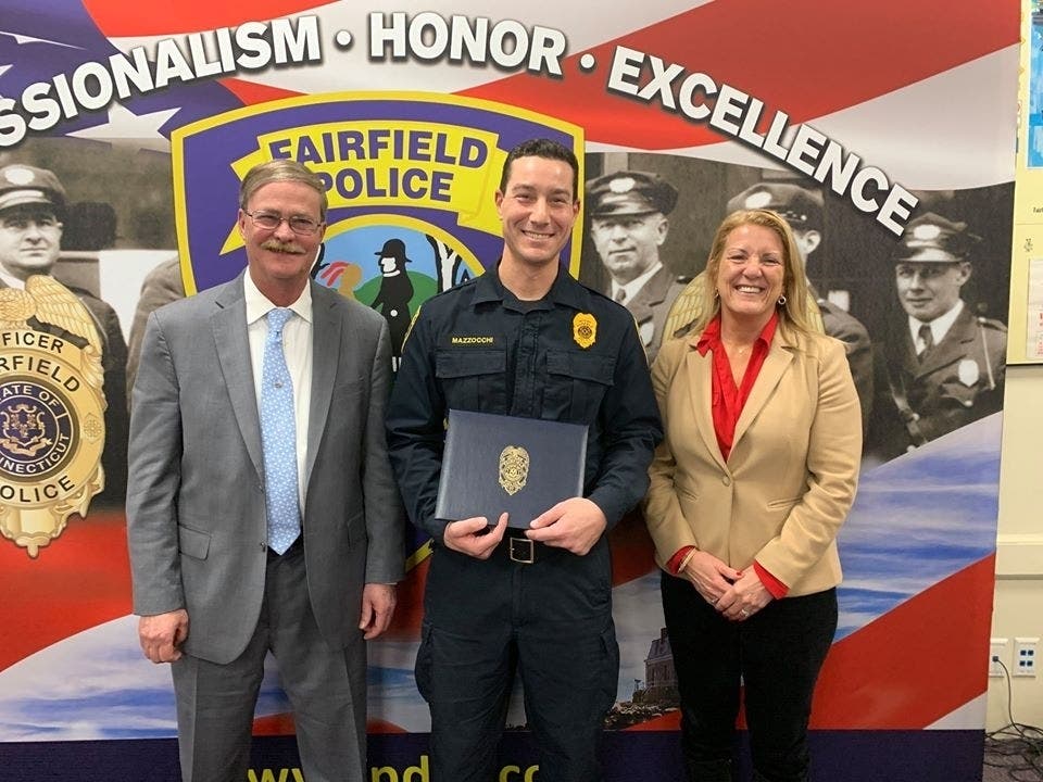 Fairfield Police Officer Michael Mazzocchi was recently presented with the Distinguished Service Award for disarming a suicidal woman at Lake Mohegan in 2016.