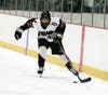 North Haven #17 Aaron Racino moves the puck during North Haven’s 5-3 win over Sheehan.