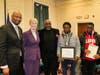 Edwin Blackwell, center, and his sons, Eli, 16, and Quincy, 15, accept a citation on behalf of the late Teresa S. Blackwell as West Haven’s African American Citizen of the Year.