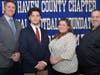 Hamden's Edwin Figueroa with his parents Brenda and Edwin (right) and coach Tom Dyer.