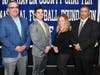 Mike Castellano with parents Christine and Joseph (left) and coach Scott Benoit.