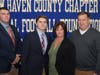 Jonathan Law's Michael Becker with parents Stefanie and Walt (right) and coach Chris Haley.