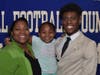 Sheehan's Terrence Bogan holding sister Taryn Knighton with mother Timeka Knighton.