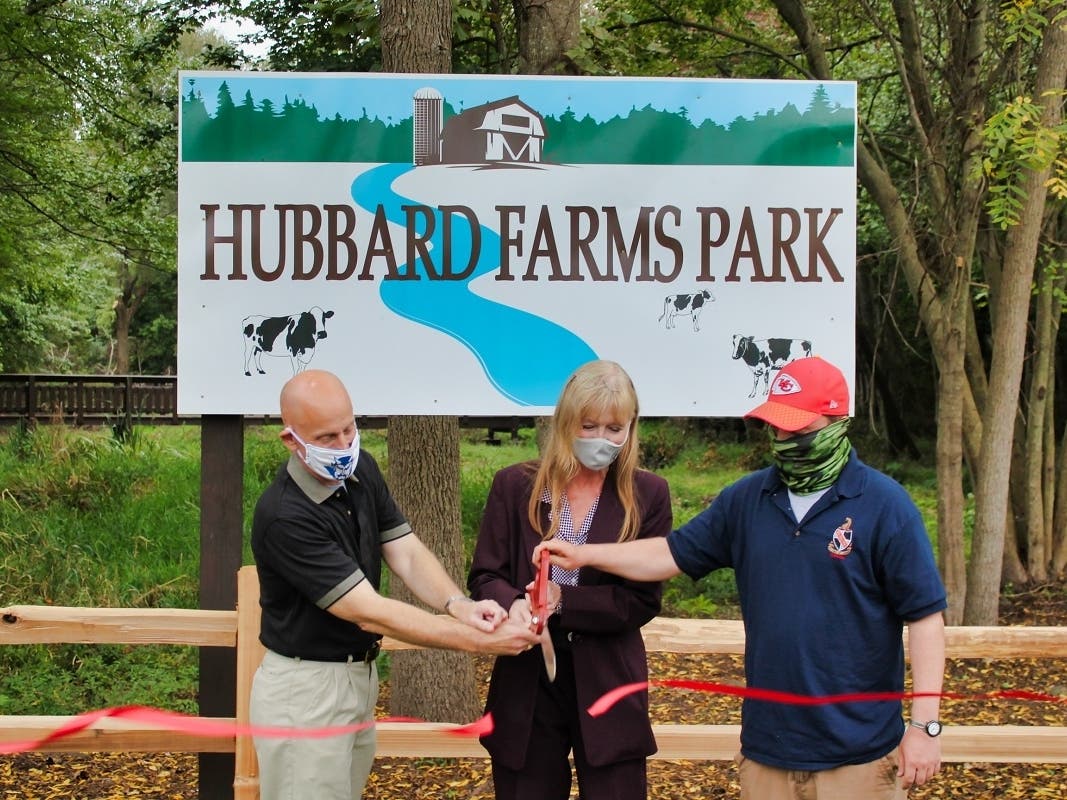 Mayor Nancy R. Rossi cuts the ribbon with 10th District Councilman Barry Lee Cohen, left, and Hubbard Family Association President Steven Johnstone to celebrate the reopening of Hubbard Farms Park in West Shore on Tuesday, Sept. 29.