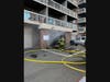 Crews work to extinguish a garage fire Wednesday afternoon at the Broadmoor Apartments in Hamden.