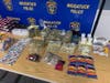 The items and cash seized after police arrested two people accused of selling drugs to a 13-year-old and a 10-year-old Sunday in Naugatuck.
