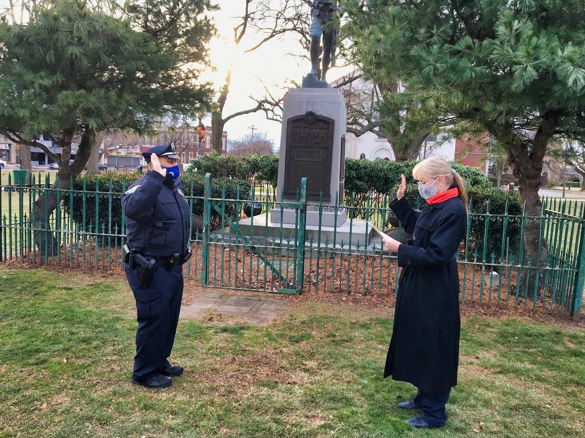 Former New Haven police Officer Richard Benson was sworn in as a University of New Haven police officer Tuesday by West Haven Mayor Nancy R. Rossi.
