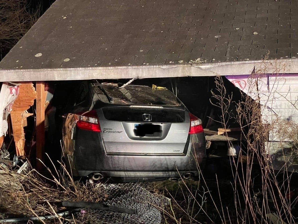 A car crashed into a garage after the driver suffered a medical emergency.