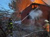 Crews work to extinguish a fire Saturday in Wallingford.