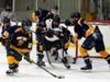 North Haven's Eli Brubacher goes at it alone in front of the East Haven net.