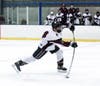 Owen Quick gets behind a shot on goal.