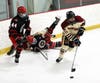 North Haven's Tommy Guidone takes control of the puck against Cheshire.