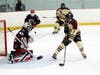 North Haven's William Sullivan and Cheshire goaltender Amaan Chaudhry go head-to-head.