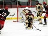 North Haven's Tommy Guidone (14) blocks a shot against Cheshire on Monday night at the Northford Ice Pavilion.