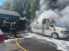 Crews work to extinguish a van fire Thursday afternoon in Hamden.