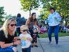 Parents and children dance to the music of The Pop Rocks.