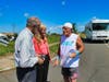 Paul “Paulie” Veneto shows West Haven Mayor Nancy Rossi and her executive assistant, Louis P. Esposito Jr., photos of flight attendants who died when United Flight 175 was flown into the World Trade Center on 9/11.