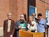 Phil Liscio is presented with a folded Italian flag from West Haven Italian American Civic Association President Paul M. Frosolone, right, and Roberta Daniels DeFonce, a past president of the association’s Ladies Auxiliary.