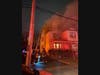 The fire extended to the second and third floors of a home on Helen Street, according to officials.