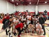 Stratford celebrates its 69-32 victory over Weston. Jayquan Kirkland scored 22 points, including his 1,000th career point, to lead the Red Devils.