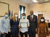 West Haven High School junior Randy Alston receives a Black Heritage Committee award for leadership from Chairman Steven R. Mullins as, from left, Alston’s father, Randy Alston, Mayor Nancy R. Rossi and Alston’s mother, Michelle Alston, look on.