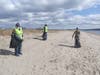 Volunteers scour the barrier beach for plastic bottles and trash that could impact nesting birds.
