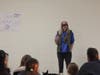 Karen Land​ shares her experiences as an Iditarod musher during a presentation inside the Sheehan High School cafeteria on Monday night.