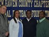 Hamden Hall's Konye Taylor with (from left to right) coach Joe Linta, mother Sirina Taylor and father Marvin Taylor.