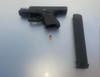 A Glock 26 with an extended 33-round magazine was found inside the vehicle, according to police.