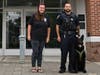 Brittany Murphy, founder of Blue Line Jars, visits with West Haven Police K-9 Jax and Officer Adam Jaworski.