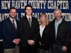 Lyman Hall's Scott Heinrich Jr. with coach CJ Monroe and parents Diane and Scott Sr.