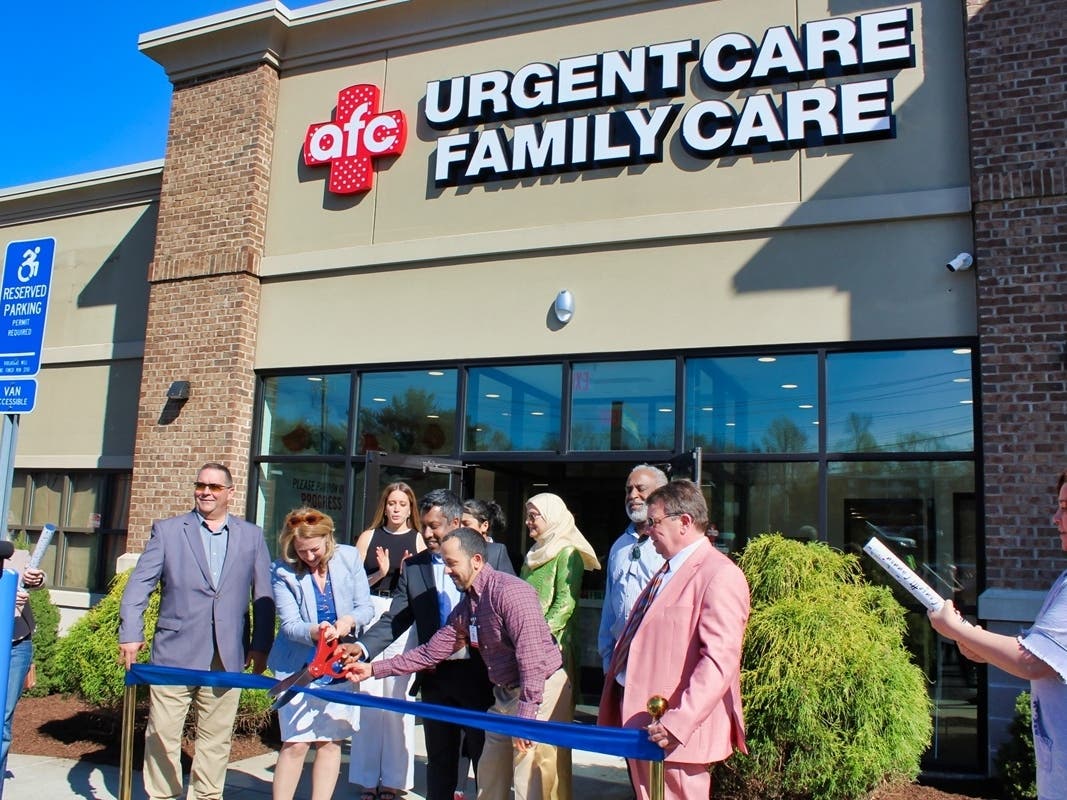 West Haven Mayor Dorinda Borer cuts the ribbon with American Family Care franchise owner Muhammad Zaman, center left, and Medical Director Dr. Felix Pacheco, center right, to celebrate the grand opening of West Haven’s new AFC Urgent Care center.