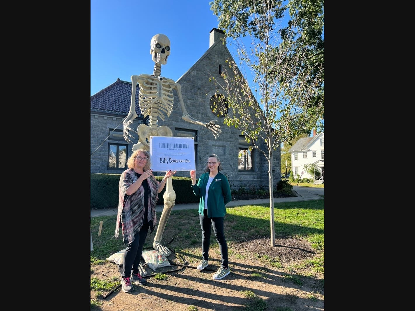 Stratford Library Director Sheri Szymanski (left) and Assistant Director Geri Diorio with "Billy Bones" in front of the Library last October.
