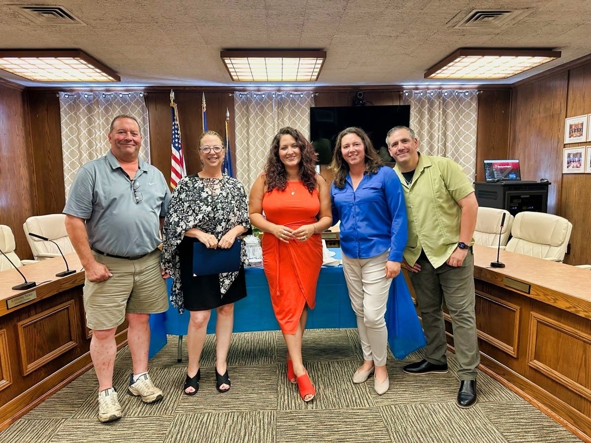 West Haven Mayor Dorinda Borer, second from left, congratulates Nicole Zuraitis, center, at City Hall. With them are, from left, Councilman Gary Donovan, D-4, Councilwoman Michelle Coletti, D-2, and City Council Chairman Nicholas A. Pascale, D-at large.