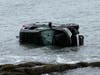 A vehicle was submerged in the water off a dead-end street in West Haven on Tuesday morning.
