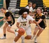 Hamden junior Saige Sampson (13) dribbles past a Law defender in Saturday's game at Hamden High School.