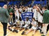 The Notre Dame-West Haven boys basketball team celebrates its SCC title after beating Fairfield Prep on Monday night at M&T Bank Arena at Quinnipiac University in Hamden.